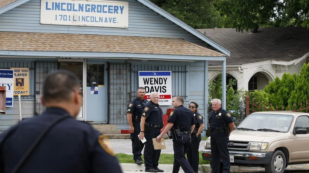 
Police work at the North Side store where a clerk fatally shot a man during an attempted robbery on Wednesday, June 17, 2016. Two men who entered the store with the dead man had not been found late Wednesday.
