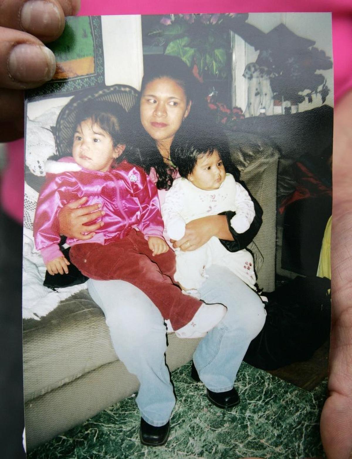 A family photo of Gilberta Estrada and two of her daughters Maria Teresa Estrada, left, and Janet Frayre.
