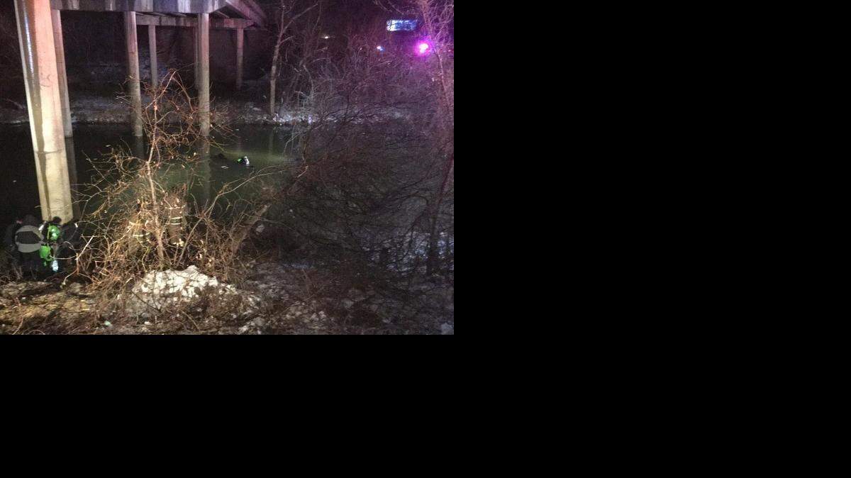 
Fort Worth Fire Department divers search for two occupants of a car that went off a bridge at I-30 and Camp Bowie on Saturday night. 
