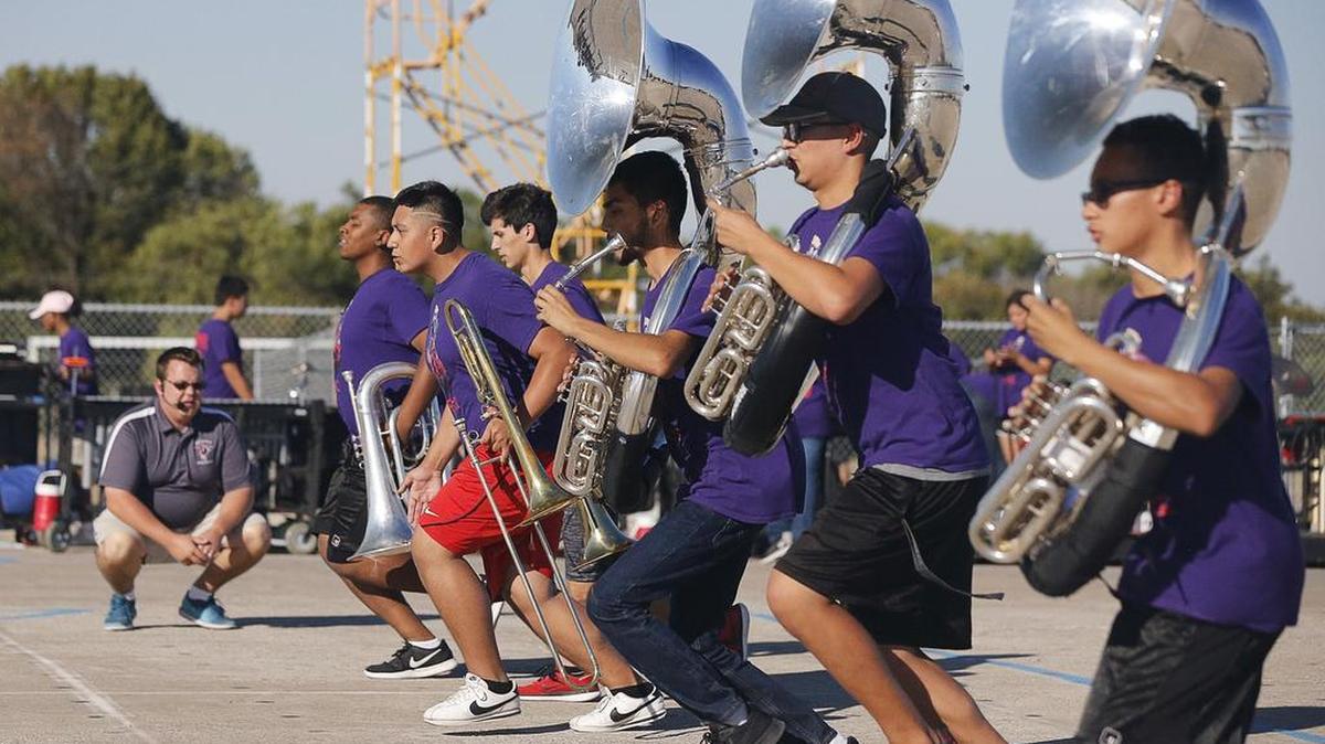 Band director Jeff DeMaagd directs practice as he gets the Southwest High School Band ready for the state band competition in San Antonio.