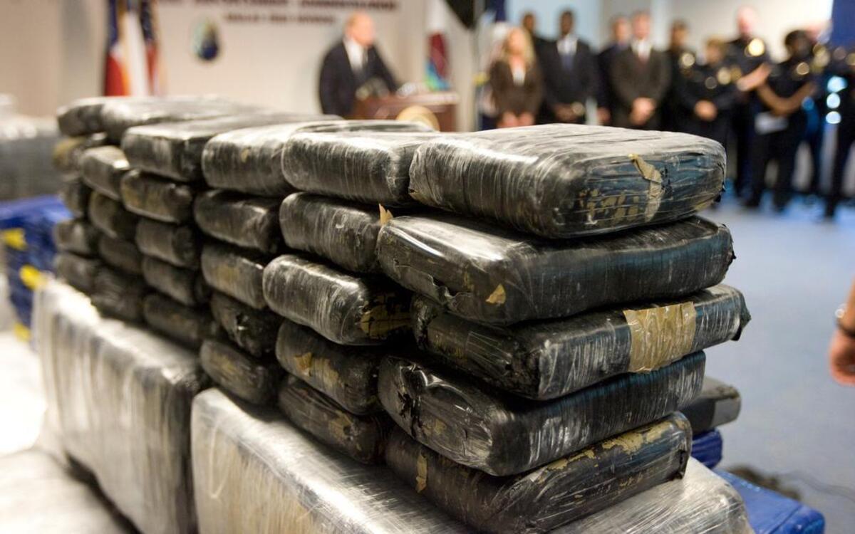 File photo of seized cocaine. Officers and agents seized approximately 26 kilograms of methamphetamine, three kilograms of heroin, four kilograms of cocaine, 22 handguns, three rifles, one silencer, 22 vehicles, one non-operational methamphetamine laboratory, and approximately $300,000.