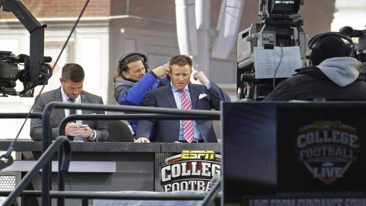 
ESPN’s Jesse Palmer, left, and Chris Cotter, right, prepare with their crew for their afternoon broadcast. Sports television network ESPN is broadcasting some of its shows, including College Football Live, from Sundance Square in Fort Worth starting Monday, Jan. 5, 2015, and during the week leading up to the National College Football Championship game.
