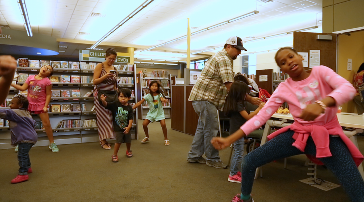 Kids dance to DJ Ken Cheezie’s tunes at the library