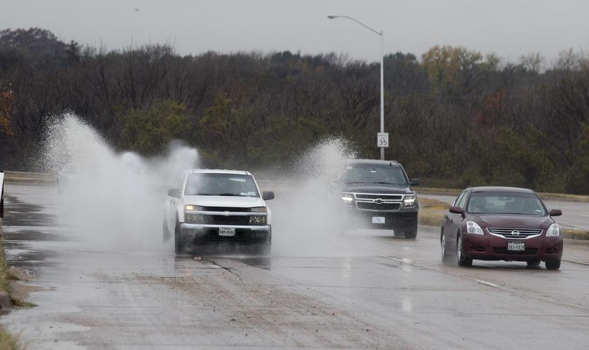 Water puddled on roadways, including North University Drive in Fort Worth, on Tuesday.