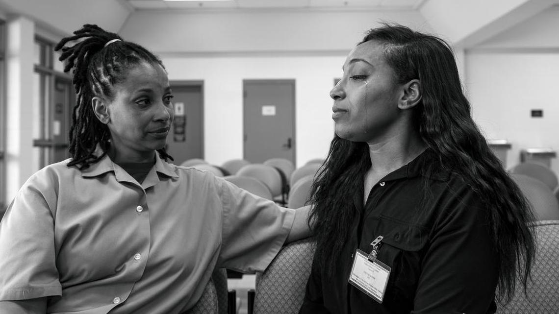 Clenesha Garland, 24, right, fights back tears during a visit with her mom, Sharanda Jones, June 10, 2015, at Carswell Federal Prison in Fort Worth..