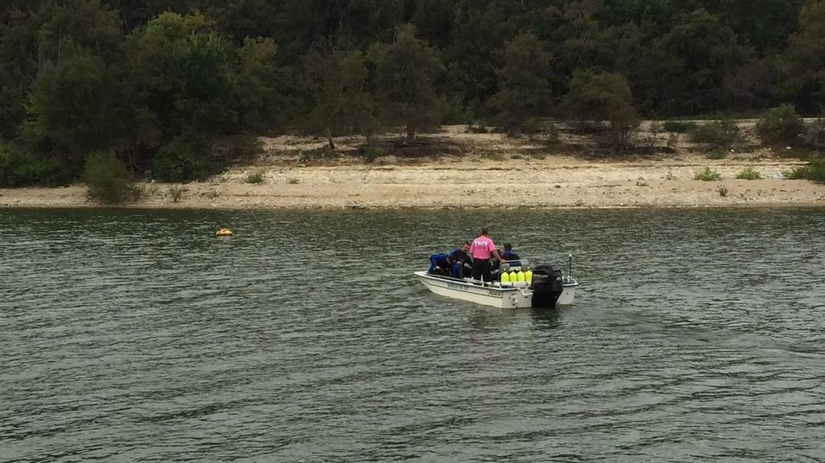 Crews searching for a body at Benbrook Lake on Thursday morning.