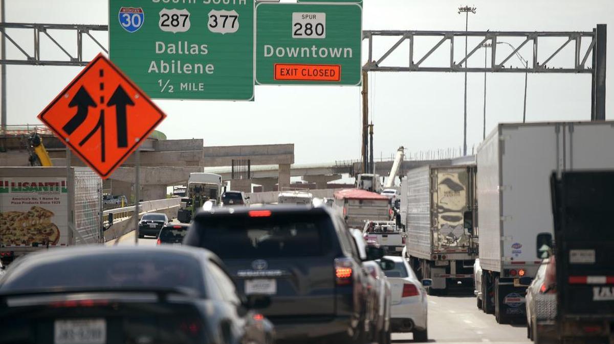 I-35W traffic flows slowly near downtown earlier this year. Nearly four million Texans will be hitting the road for Thanksgiving travel this week, according to AAA.