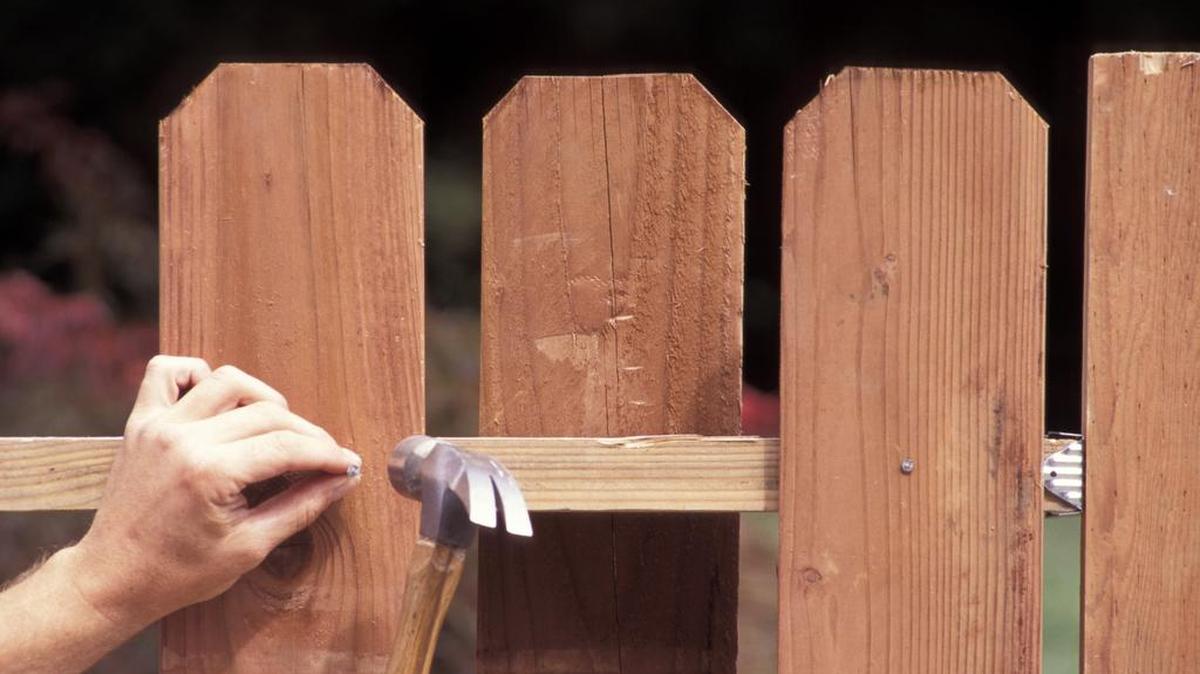 Members of the law enforcement community fixed a fence for a fallen comrade’s family.