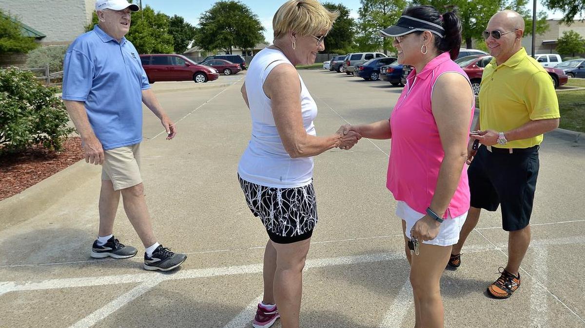 Following a nearby walking town hall, Fort Worth Mayor Betsy Price and District 7 Councilman Dennis Shingleton stop at Summerglen Branch Library to greet voters Joe and Rosie Calvillo.
