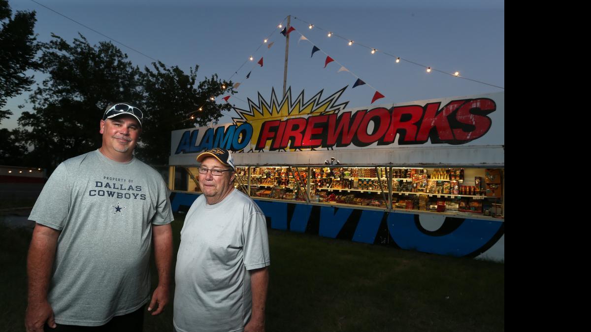 
Monty Griffin and Jerry Mason work the Alamo Fireworks stand on Farm Road 1187 in Rendon.
