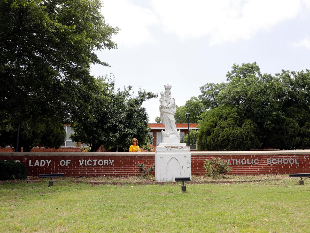 Principal Linda Kuntz in front of Our Lady of Victory Catholic School in Fort Worth. The school is closing after serving Fort Worth students for over 100 years.