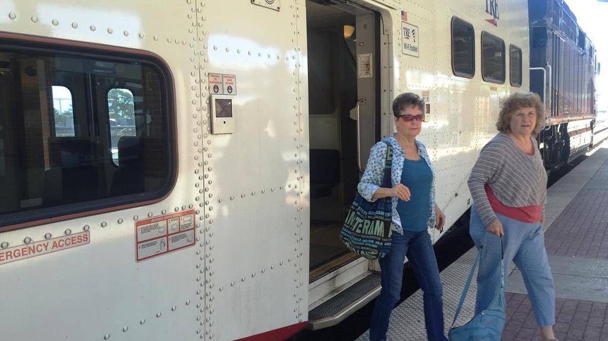 
Passengers depart a Trinity Railway Express train Wednesday at the Intermodal Transportation Center in downtown Fort Worth. 
