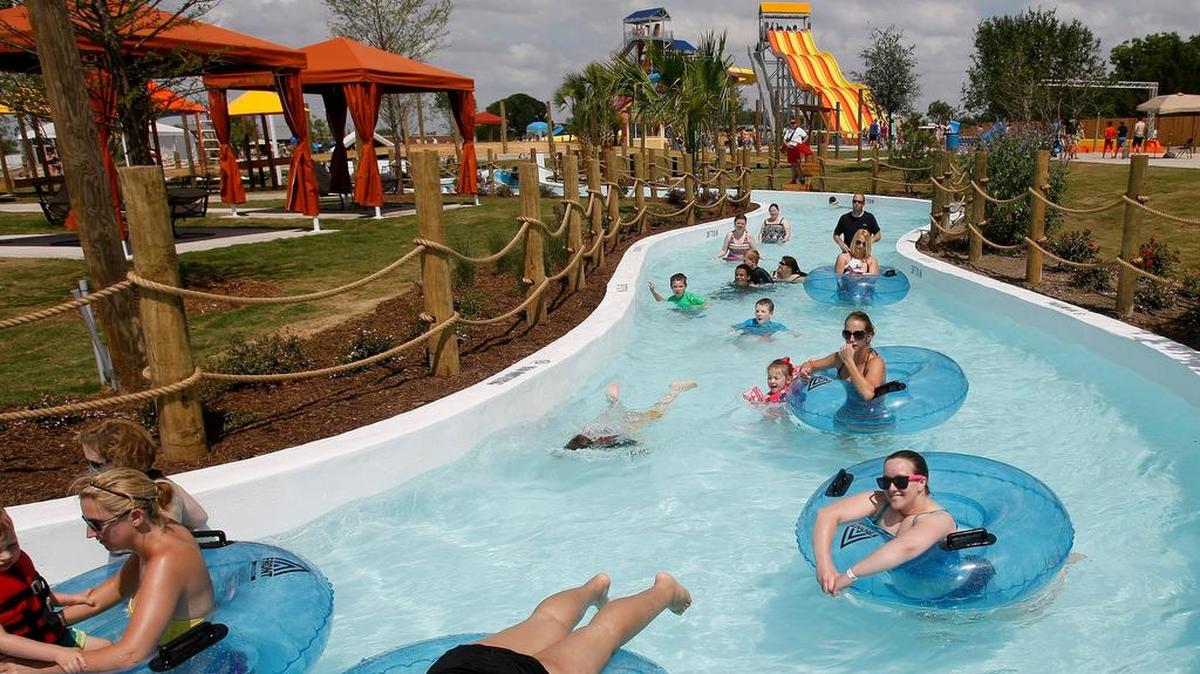 Guests drift through the lazy river at Hawaiian Falls in White Settlement on June 5, 2014.