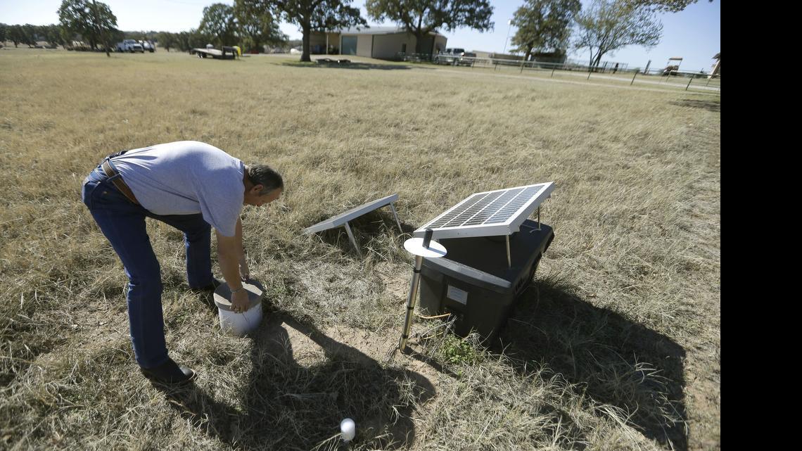 
 A researcher checks a solar powered seismic monitor installed by Southern Methodist University to record earthquakes in the area around Reno last November. State legislators are proposing to spend $4.4 million on equipment and analysis of earthquake activity in the state. 
