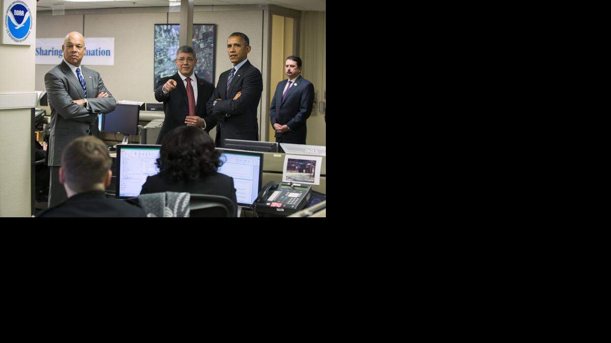 
President Barack Obama, right, and Secretary of Homeland Security Jeh Johnson, left,  tour  the National Operations Center on Monday.
 
