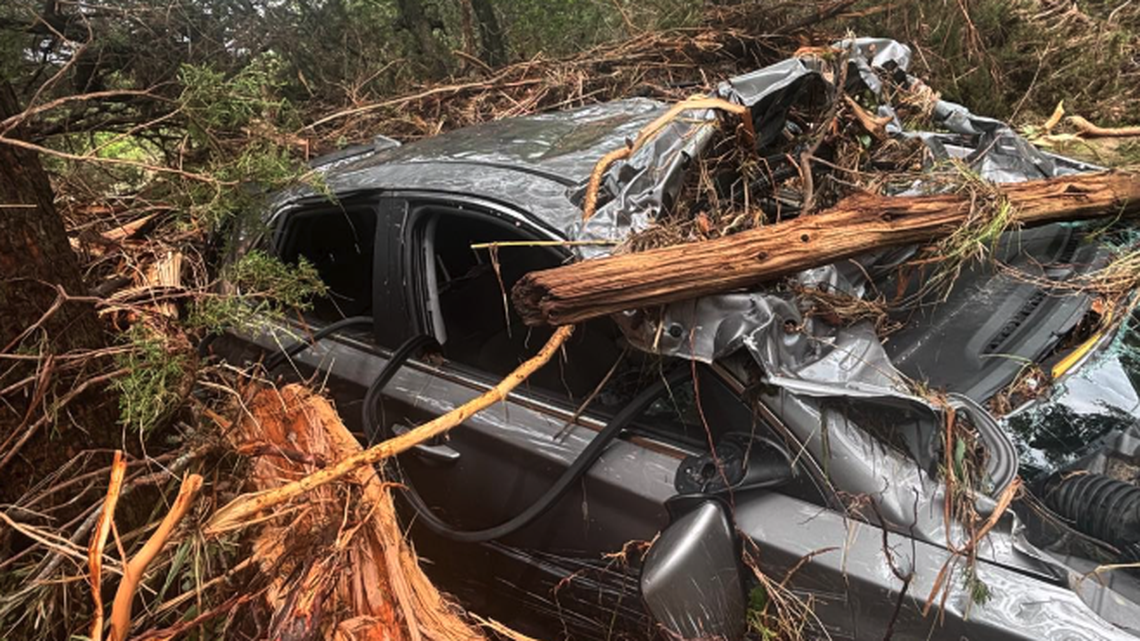 Two people were rescued when their vehicle was swept a mile downstream during Texas flooding, authorities say. Unfounded conspiracy theories related to secret technologies and the flooding abound.