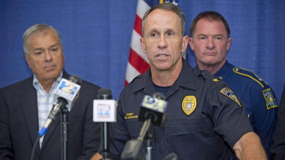 Baton Rouge Police Chief Carl Dabadie speaks at the lectern, in front of, East Baton Rouge Parish Sheriff Sid Gautreaux, left, and Louisiana State Police Col. Mike Edmonson during a news conference July 12 in Baton Rouge, La.