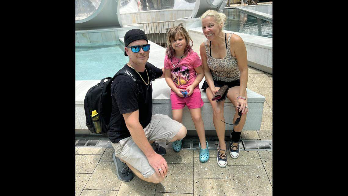 This provided photo shows Paisley and her parents, Christopher Dohse and Kimberly Pittard, who are suing their daughter’s school district in Fort Bend County, Texas.