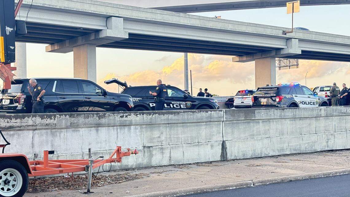 A man accused of kidnapping his wife and child was shot dead by officers on a Houston, Texas, freeway, police say.