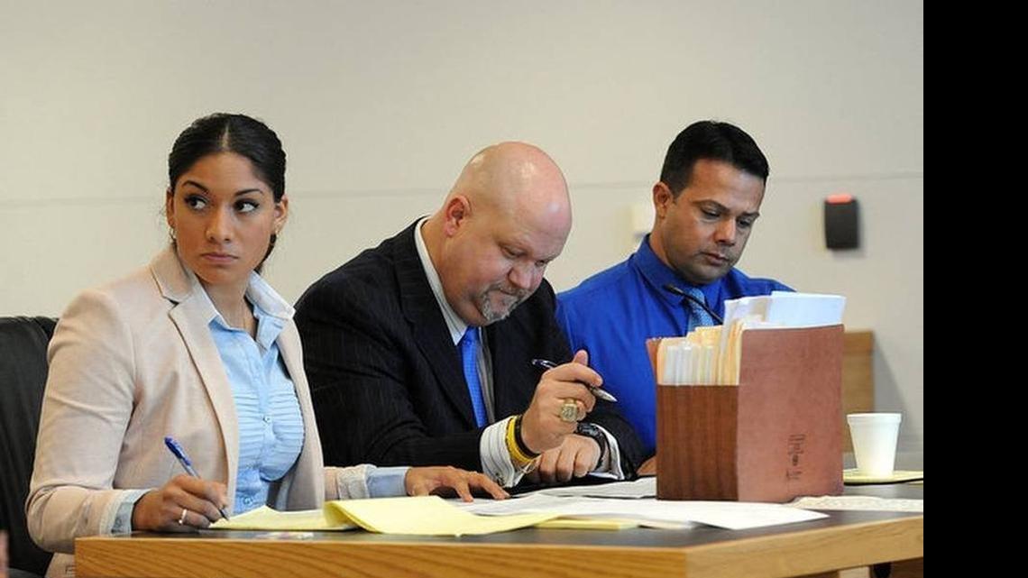 
Elissa Alvarez, 20, and Jose Caballero, 40, sit on either side of their attorney, Ronald Kurpiers, as they try to choose a jury for the trial for two counts of lewd and lascivious exhibition each after multiple witnesses reported to law enforcement that the two had been having sex on Cortez Beach at 8:36 p.m. on July 20, 2014. 
