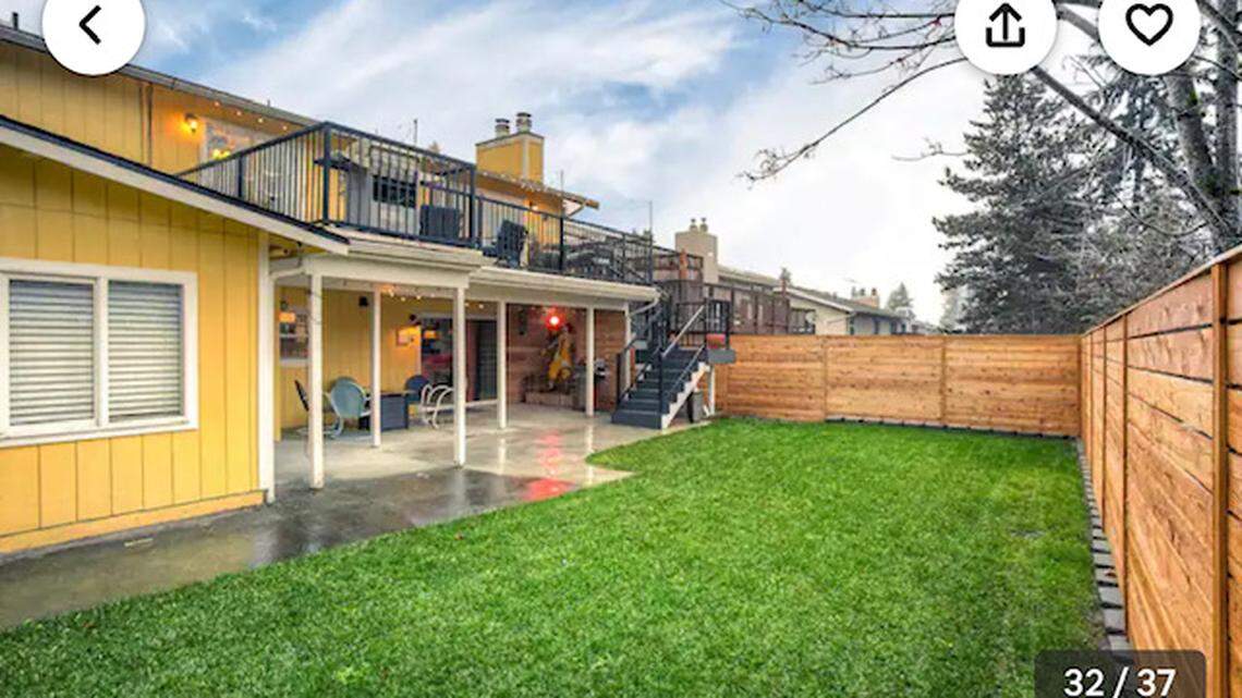 The colorful Airbnb has a fenced backyard.