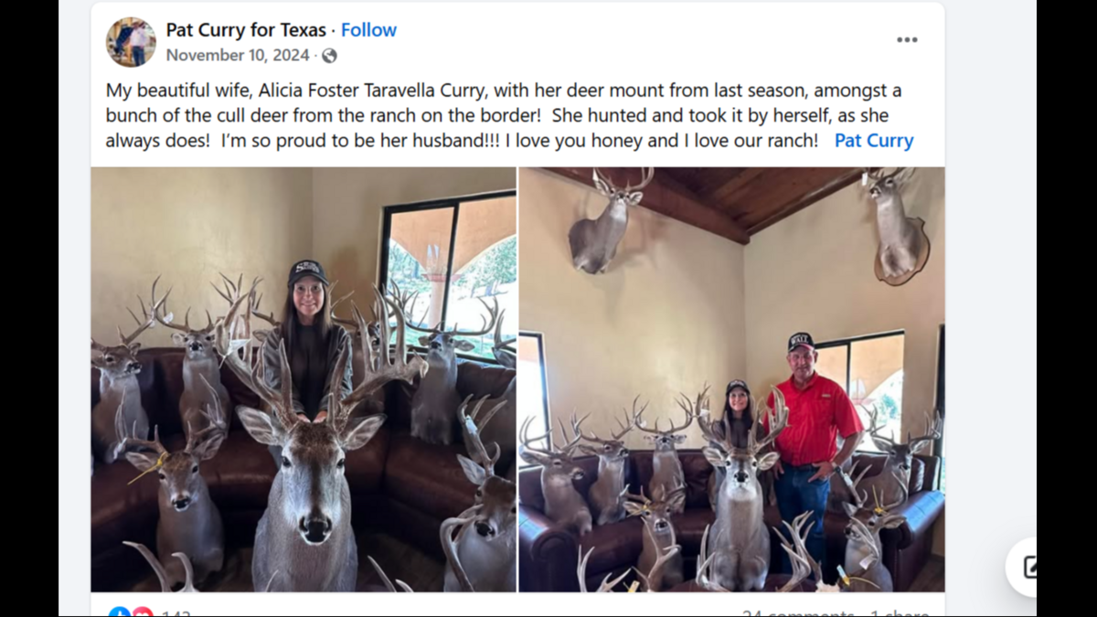 Pat Curry poses for a photo with his wife and numerous deer trophies.