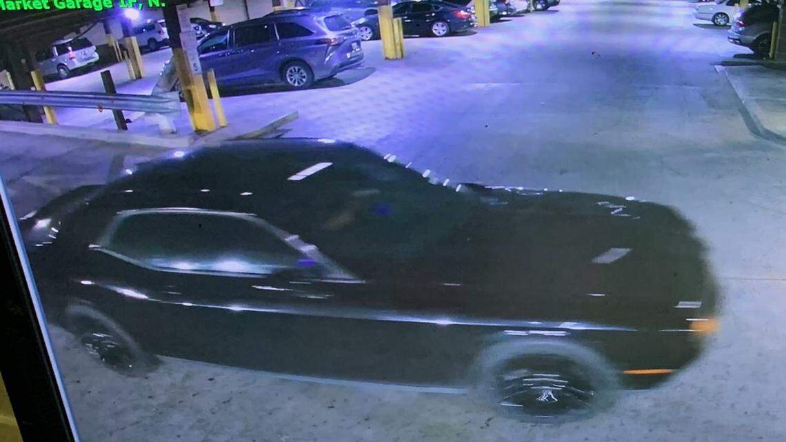 Officers are searching for a person of interest driving a black Dodge Challenger. They are wanted for questioning in the death of a woman, whose body was found decomposing in a parking garage.