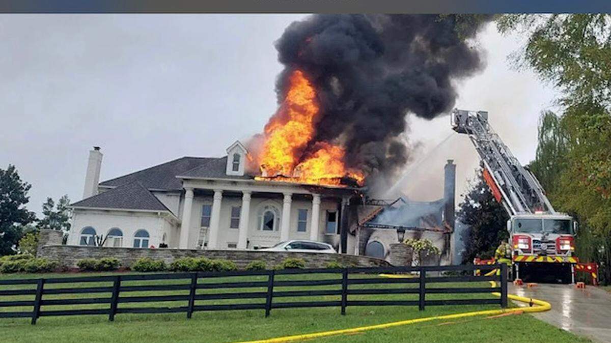 The mansion engulfed in flames