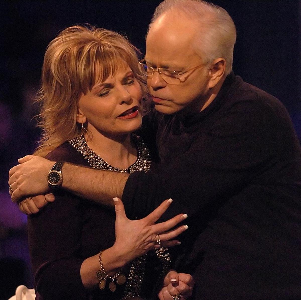 In 2005, Jim Bakker and wife Lori appeared at a New Year’s conference on the grounds of what was once PTL’s Heritage USA. By then, it had been purchased by MorningStar Fellowship, which sponsored the conference. Here, the couple pray after his sermon.
