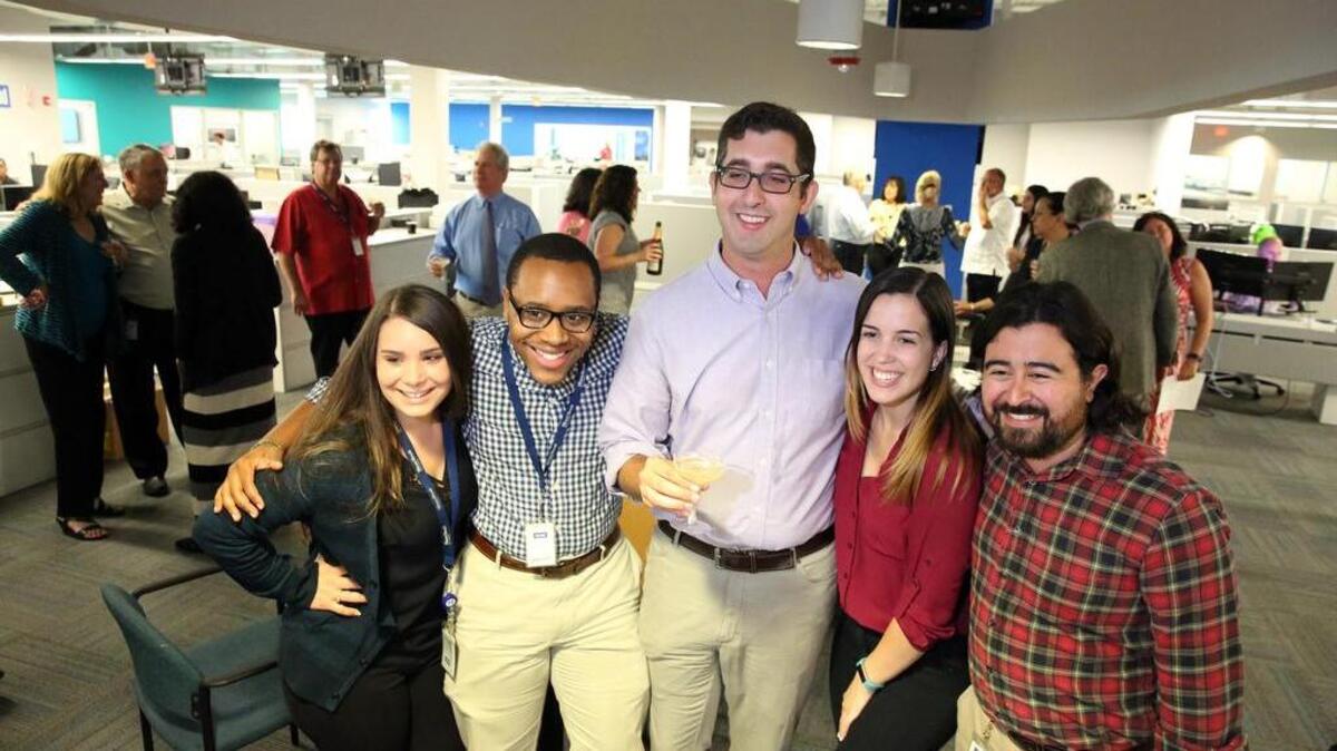 Investigative reporter Nick Nehamas, center, is surrounded by fellow reporters Monique Madan, Lance Dixon, Chabeli Herrera and Joey Flechas on Monday. Nehamas was part of the staff covering the ‘Panama Papers,’ the international investigation that exposed how crooks and millionaires use the secret world of offshore companies. The project won the Miami Herald one of two Pulitzer Prizes awarded to the paper.