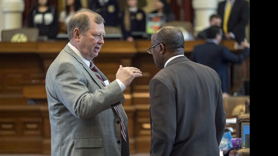 
House Rep. John Otto, R- Dayton, left, and Rep. Sylvester Turner, D- Houston, right, speak on the House floor of the State Capitol in Austin, Texas, on Thursday, May 21, 2015.
