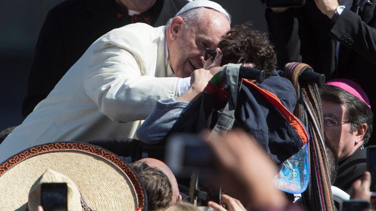 Live: Pope Francis kisses a child in a wheelchair, at Mexico City's main sqaure, the Zocalo, Saturday, Feb. 13, 2016. Pope Francis kicks off his first trip to Mexico on Saturday with speeches to the country's political and ecclesial elites. The pontiff's five-day visit will include a very personal prayer at the Virgin of Guadalupe shrine. (AP Photo/Christian Palma)