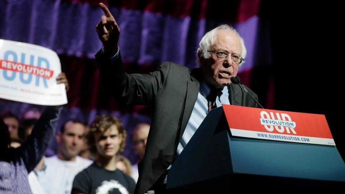 Sen. Bernie Sanders, I-Vt., addresses an audience during a rally Friday, March 31, 2017, in Boston. Sanders and Sen. Elizabeth Warren, D-Mass., made a joint appearance at the evening rally in Boston as liberals continue to mobilize against the agenda of Republican President Donald Trump.