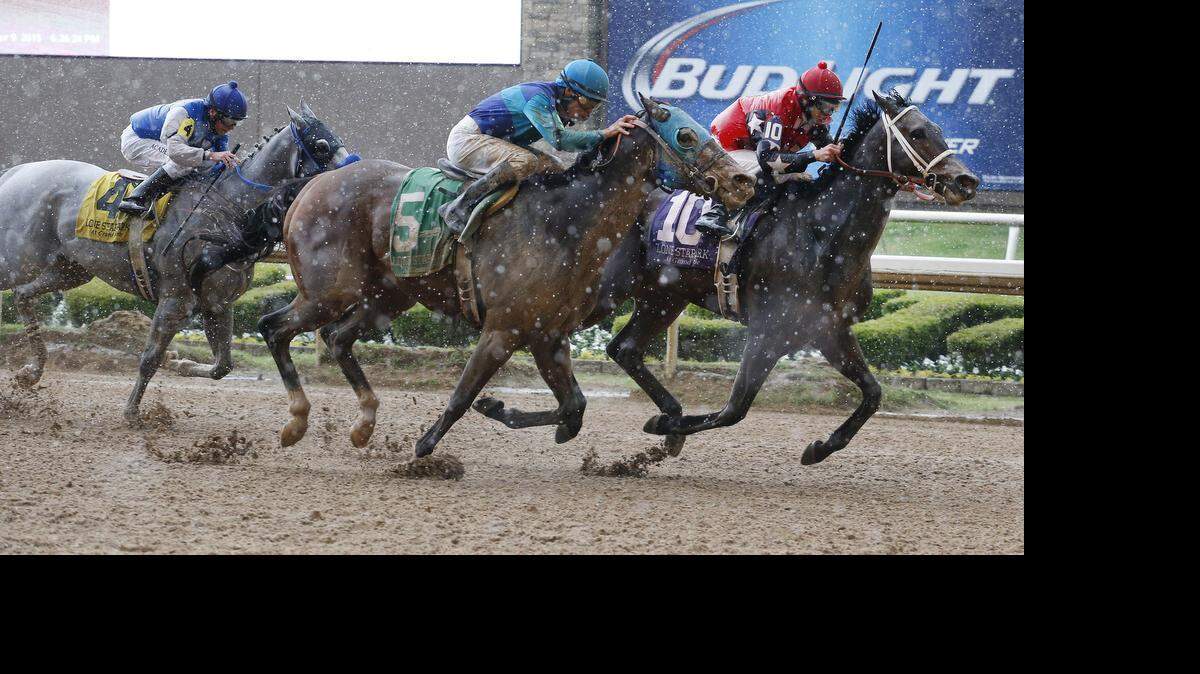 
The races at Lone Star Park kicked off April 9. In this photo, Wagson ridden by Lindey Wade, right, leads Solar Charge ridden by Gerardo Mora and famed jockey Russell Baze on He’s a Bling to the finish in the opening race of the Spring Thoroughbred season. 
