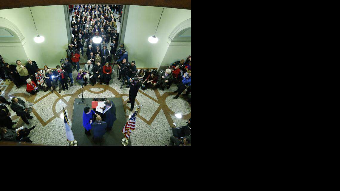 
Sheriff Dee Anderson, right, swears in Sharen Wilson as Criminal District Attorney for Tarrant County before a standing-room-only crowd in the Tarrant County Courthouse in Fort Worth, TX Thursday, Jan. 1, 2015. 
