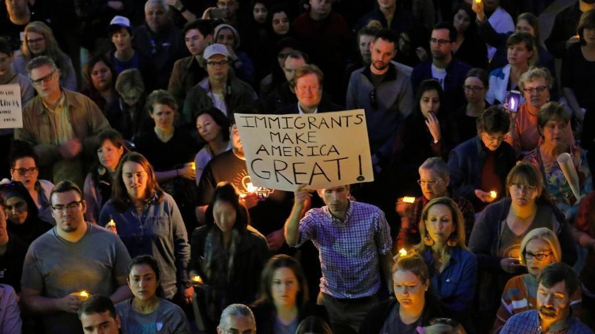 Hundreds protest at a vigil for refugees in Dallas at Thanksgiving Plaza, Jan. 30, 2017.