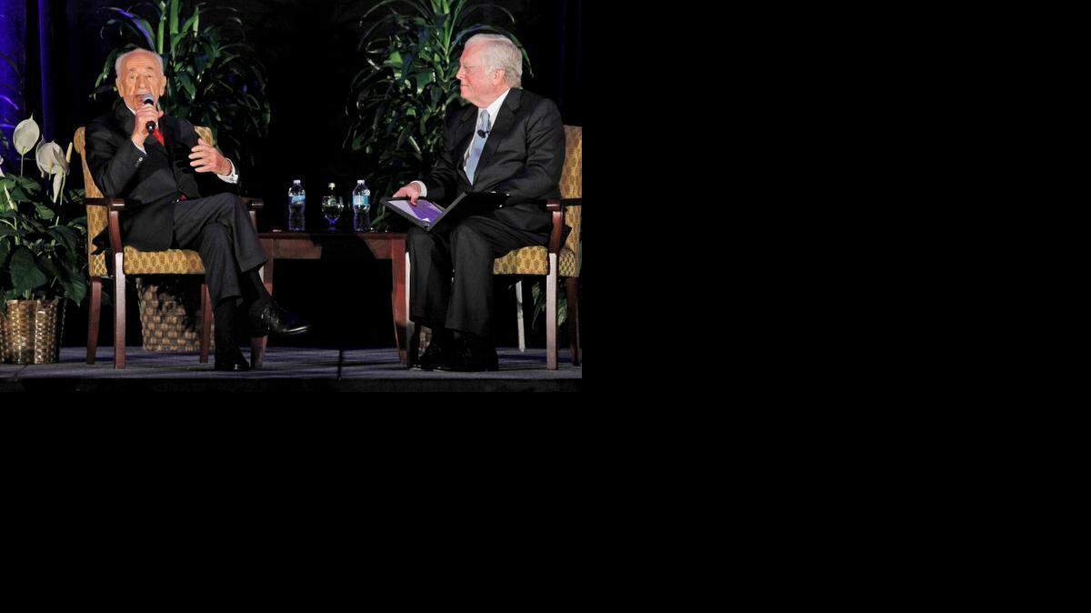 
Shimon Peres (left) with moderator former U.S. Ambassador Tom Schieffer (right). Shimon Peres, ninth President of the State Of Israel, spoke at the Tarrant County College Foundation luncheon at the Fort Worth Convention Center Monday. 
