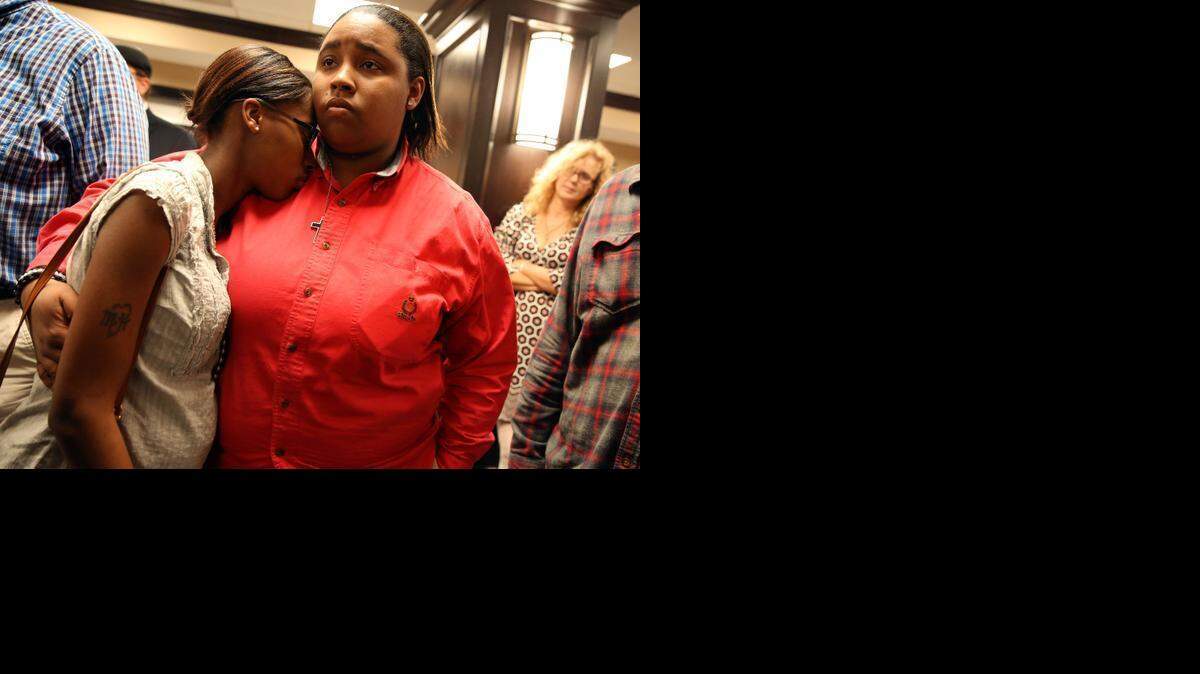 
Shay French, right, and Kiera Willis, both of Mobile, Ala., embrace after learning that Mobile County probate judge Don Davis refused to issue marriage licenses at the Mobile County Probate office in Mobile, Ala., Monday, Feb. 9, 2015. 
