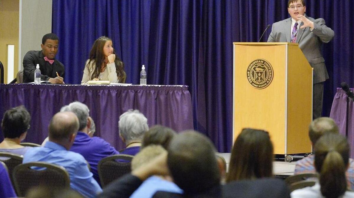 
TCU student Timothy Betts, a junior who is majoring in philosophy and economics, speaks against allowing people to carry guns on campus during a debate on Thursday. 
