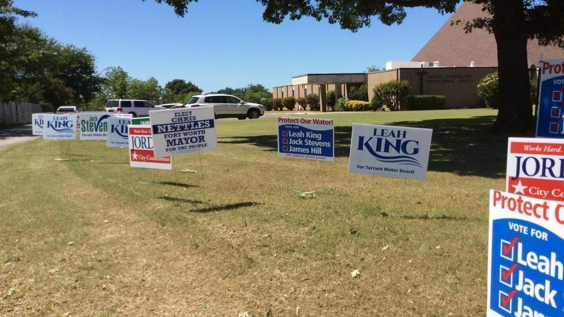 Election signs dot the front of Trinity Cumberland Presbyterian church, a polling place in southwest Fort Worth, on Saturday.