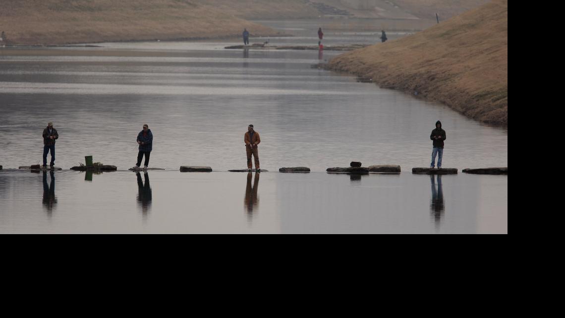 
Anglers drop their lines in the Trinity River in 2010 after the Tarrant Regional Water District released 2,500 rainbow trout into that part of the river.
