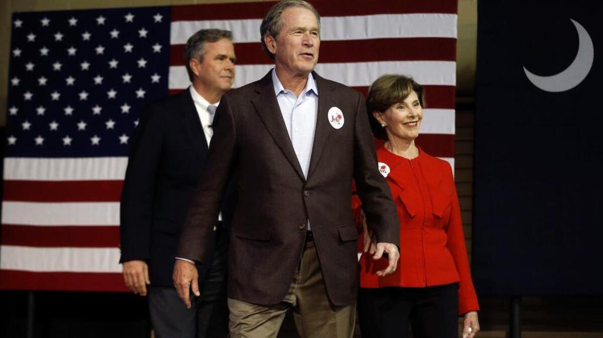 Live: Republican presidential candidate and former Florida Gov. Jeb Bush, left, accompanied by his brother former President George W. Bush, center, and George's wife Laura Bush take the stage during a campaign stop Monday, Feb. 15, 2016, in North Charleston, S.C. (AP Photo/Matt Rourke)