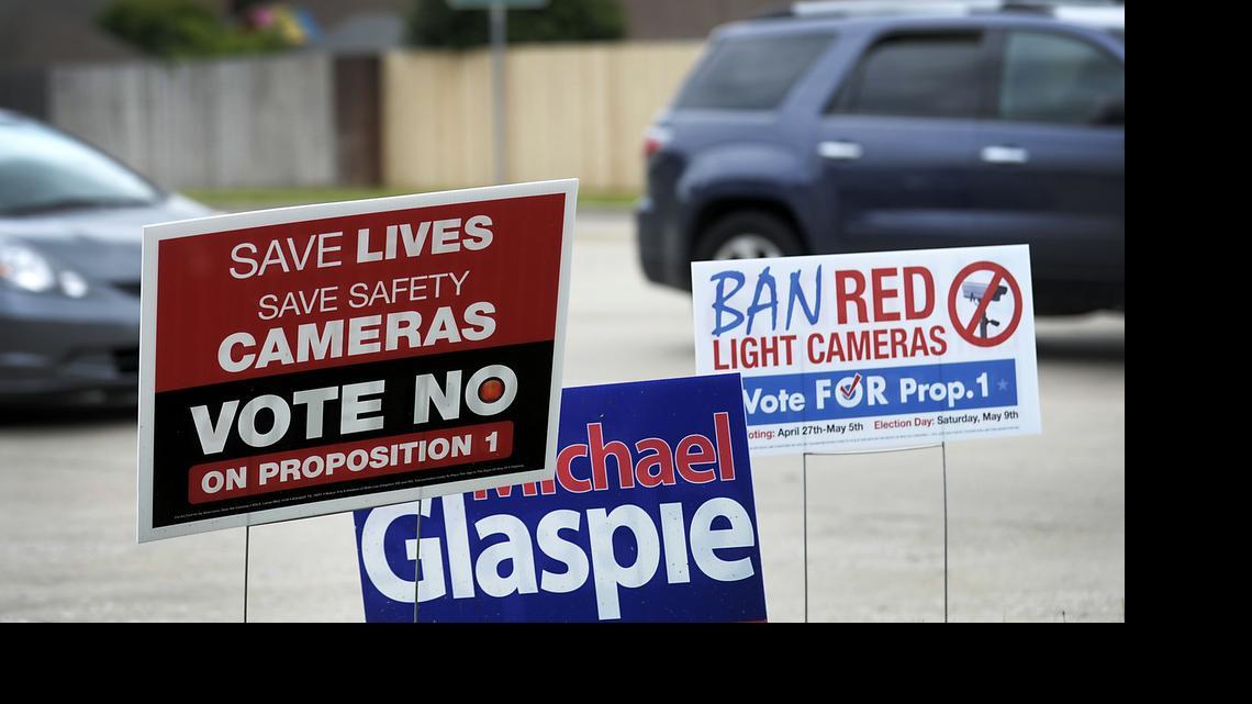 
Campaign signs in Arlington promoted both sides of the red light camera vote. These were seen at the Elzie Odoms Recreation Center. 
