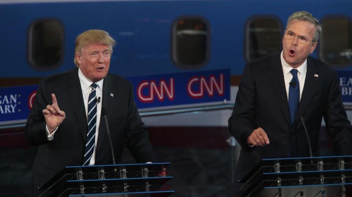 
Republican presidential candidates Donald Trump, left, and Jeb Bush spar early in the GOP debate at the Reagan Library in Simi Valley, Calif., on Wednesday, Sept. 16, 2015. 
