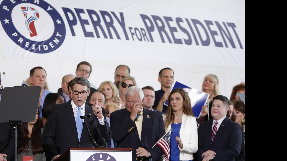 
Former Texas Gov. Rick Perry announces his second presidential bid during a rally at an Addison airport hangar, Thursday, June 4, 2015. 
