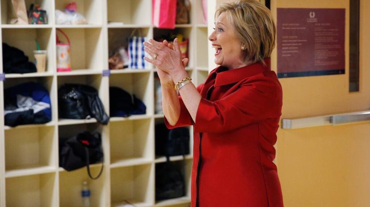 Live: Democratic presidential candidate Hillary Clinton reacts as she visits with Harrah's Las Vegas employees on the day of the Nevada Democratic caucus, Saturday, Feb. 20, 2016, in Las Vegas. (AP Photo/John Locher)