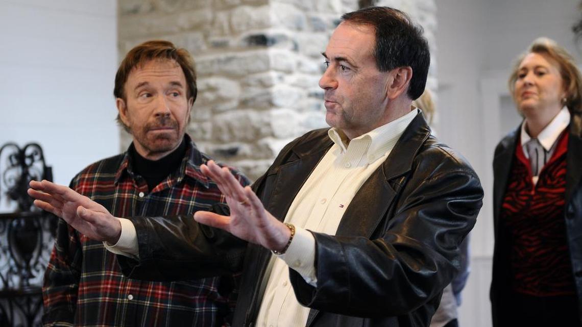 File: Republican presidential hopeful Mike Huckabee, center, makes a point as television star Chuck Norris, left, and Huckabee's wife Janet listen Sunday, Jan. 20, 2008, in Navasota, Texas. (AP Photo/Pat Sullivan) ORG XMIT: TXPS103