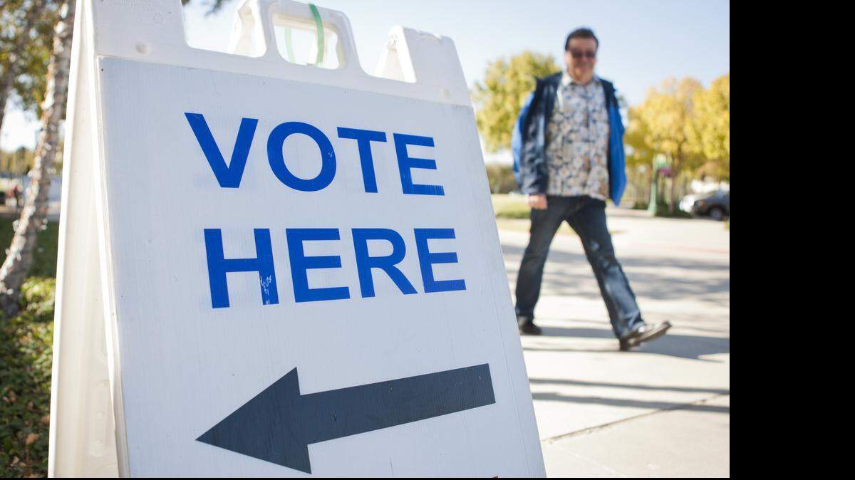 
A voter approaches the polling place on October 31, 2014 at Keller Town Hall. Early voting for the May 9 election runs through May 5. 


