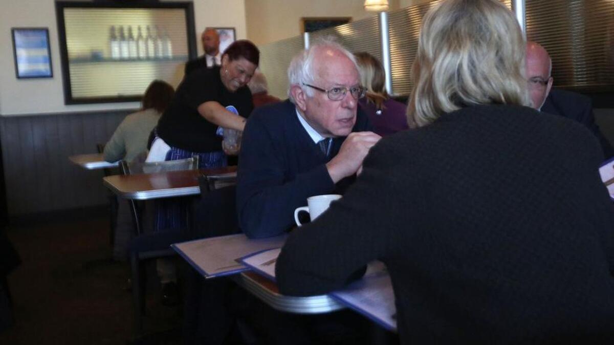 Live: Democratic presidential candidate Sen. Bernie Sanders, I-Vt., talks with Barbara Lawton, former Lt. Gov. of Wisconsin, as he visits Blue's diner during a campaign stop, Tuesday, April 5, 2016, in Milwaukee. (Mike De Sisti/Milwaukee Journal-Sentinel via AP) MANDATORY CREDIT