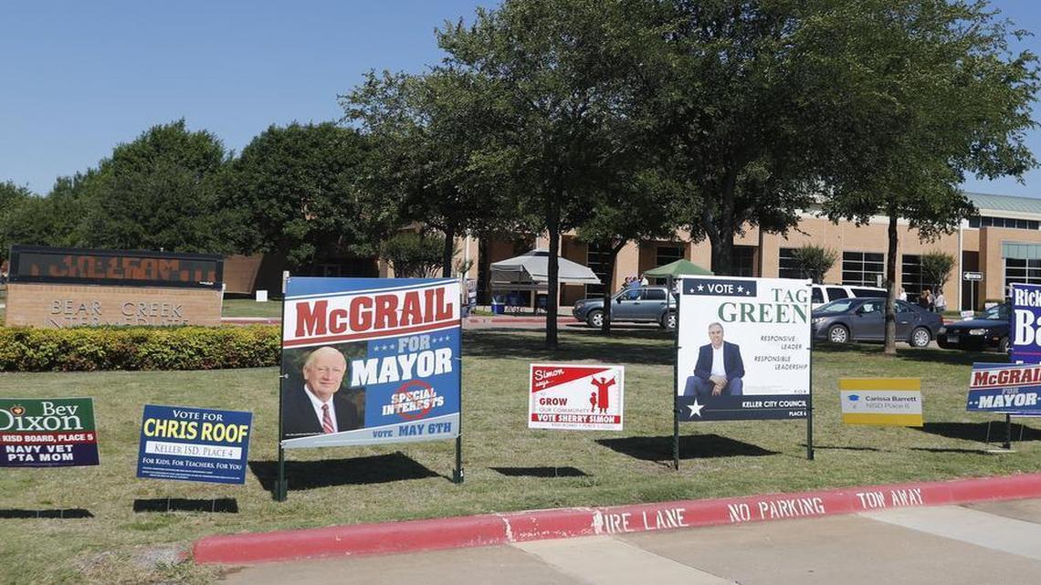 Political signs line the entrance to Bear Creek Intermediate School in Keller during local elections Saturday May 6, 2017.